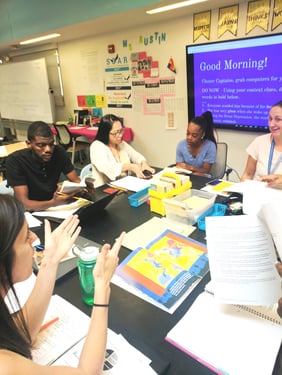 A group of educators sitting around a table during a meeting