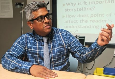 An educator speaking to the other individuals